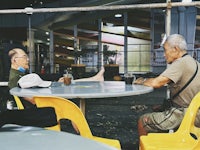 two men sitting at a table